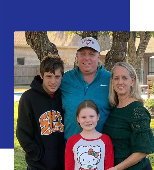 Access-Sciences-Blog-Supporting-Working-Moms-STAR-STEFKA-BORG-1 A family of four poses outdoors with trees in the background, reflecting support for working moms in a warm, happy setting.