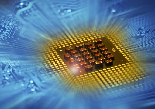 Close-up of a computer microchip on a blue circuit board, with a glowing yellow light effect radiating from the chip—highlighting the cutting-edge advancements found in semiconductor-fabrication-plants and digital technology.